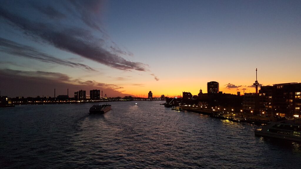 Rotterdam Holland and a view of the Maas River at sunset from the Erasmus Bridge (Erasmusbrug)