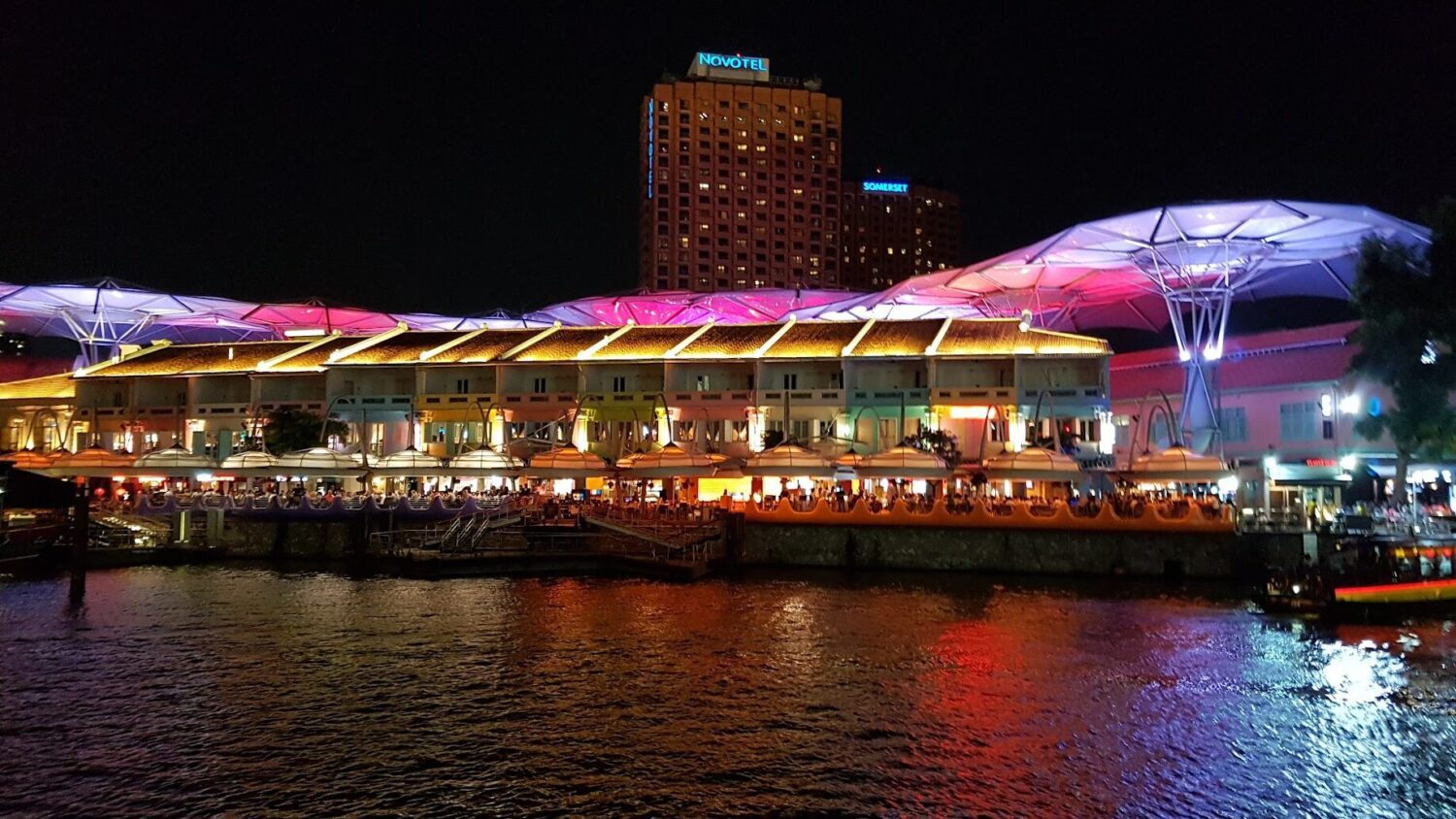 Riverfront attractions along the Singapore river in Clarke Quay at night