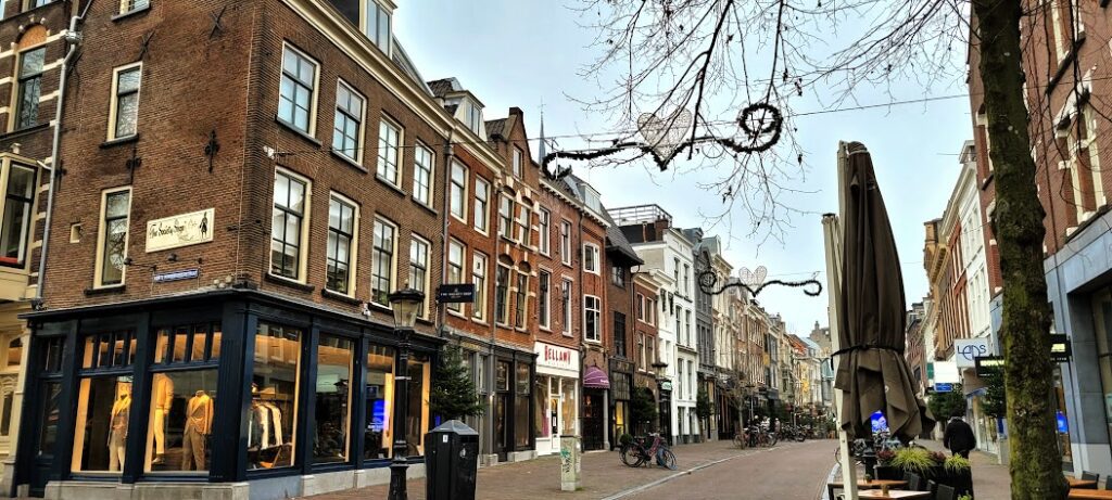 Cozy shopping streets are abundant in Utrecht, featuring a great mix of restaurants, cafés and bars as well as theatres and music halls. Shown here is a view down 'Oudkerkhof' street 