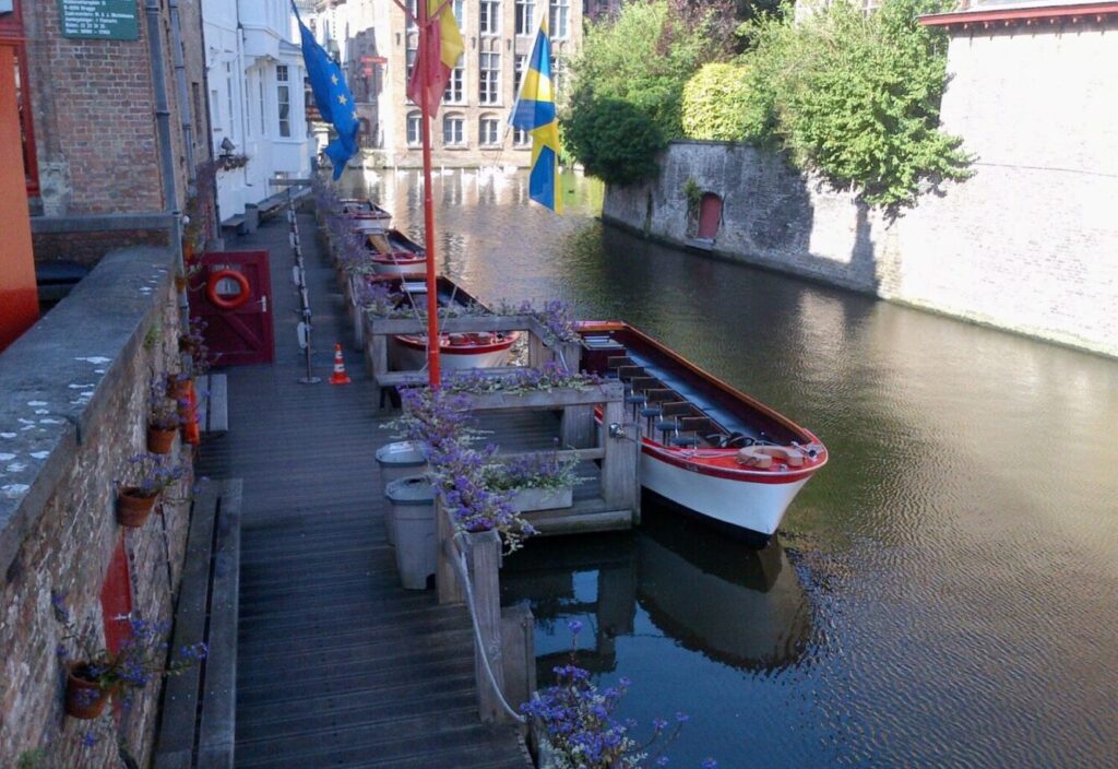 A Canal tour boat in Bruges. Canal tours are a must-do activity in Bruges, with some of the best scenery only accessible by boat.