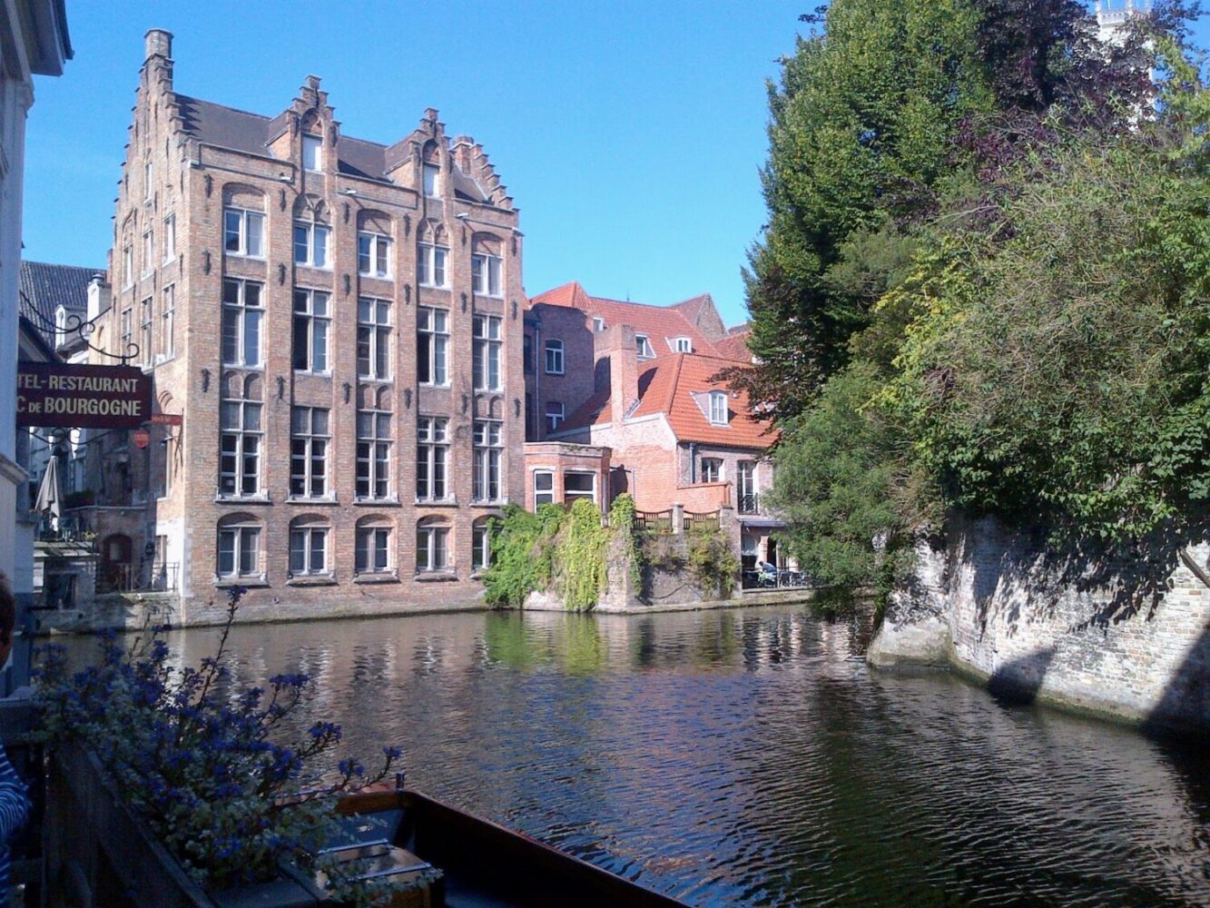 View of the amazing canal architecture from the water in Bruges, Belgian