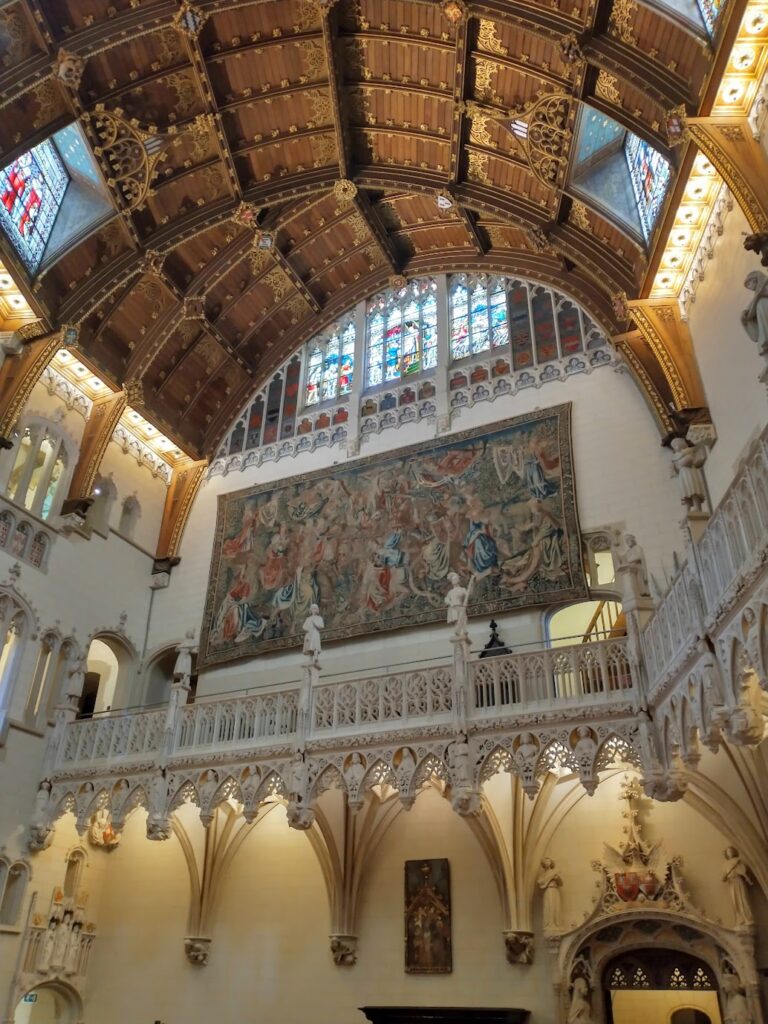 The expansive ceiling and stained glass treatment in Castle de Haar's exquisite interior 