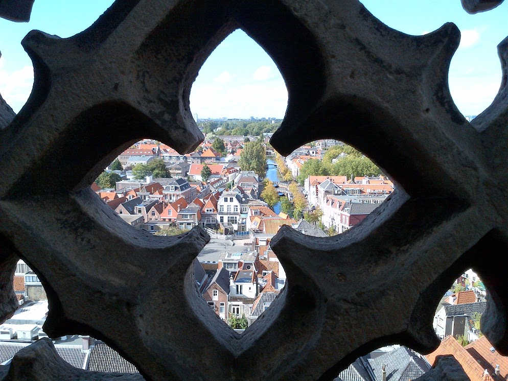 View of Delft's exquisite canals from part way up the climb of New Church in Delft's Main Square. 