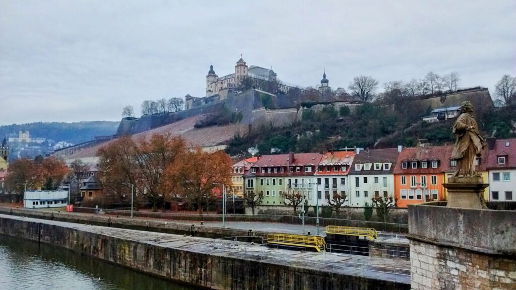 View of Würzburg's Marienberg Fortress stands high above the city overlooking the steep banks of the vineyards below