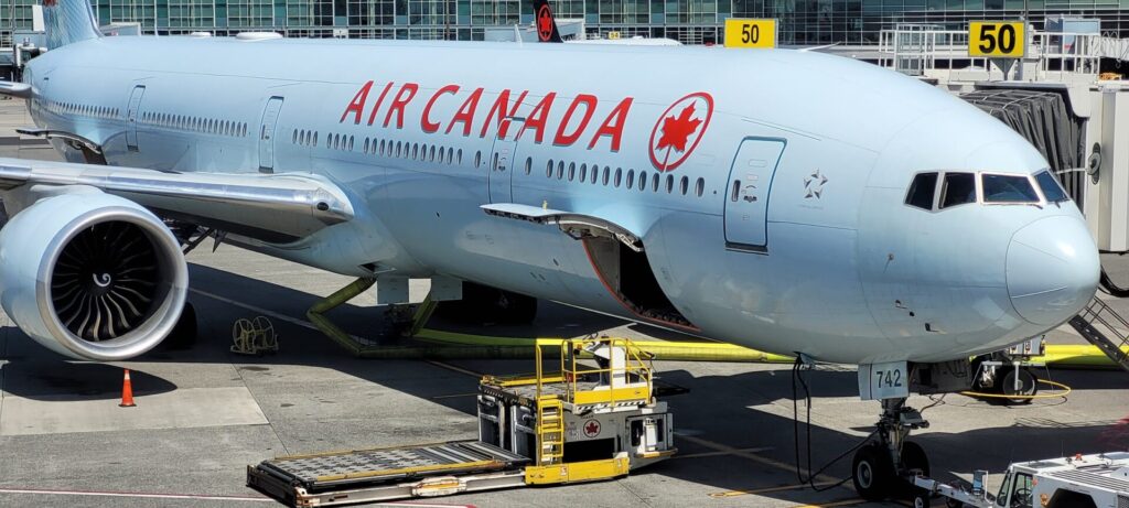 Picture of An Air Canada 777 300 ER awaiting passengers