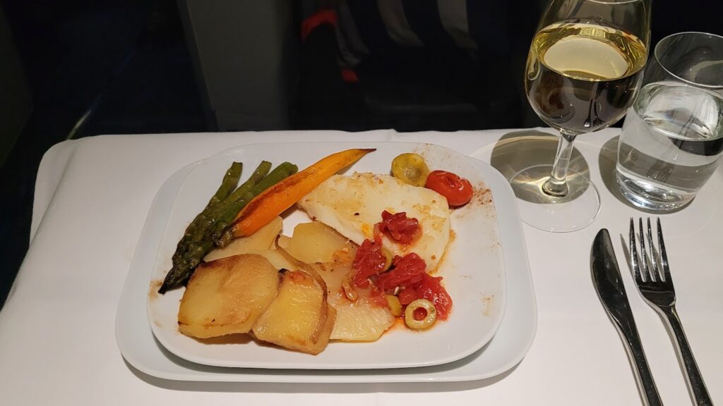 Dinner service of Pan fried Sea Bass in Lufthansa Business Class