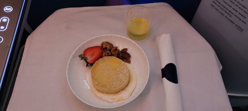lemon tart with candied nuts dessert on the KLM Dreamliner 787-10